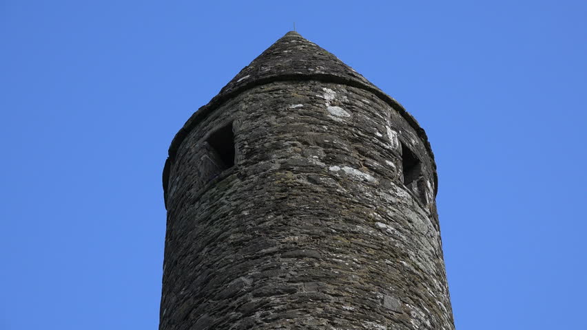 The conical roof on the round tower at Glendalough was rebuilt in the nineteenth century. The tower dates from medieval times.