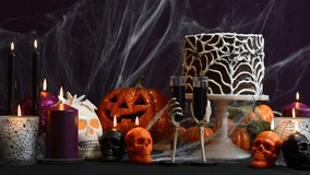 Spooky Halloween Party Table with chocolate spider cake, full table static.  - Powered by Shutterstock - Get 15% off with code: PIKWIZARD15