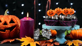 Halloween party table with chocolate cupcakes, mid focus static. - Powered by Shutterstock - Get 15% off with code: PIKWIZARD15