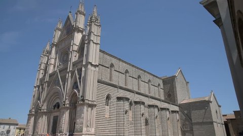 ORVIETO, ITALY - JULY 2017: Tourists visit Orvieto Cathedral (Duomo di Orvieto, Cattedrale di Santa Maria Assunta)