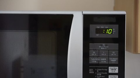 Digital microwave timer counting down from ten