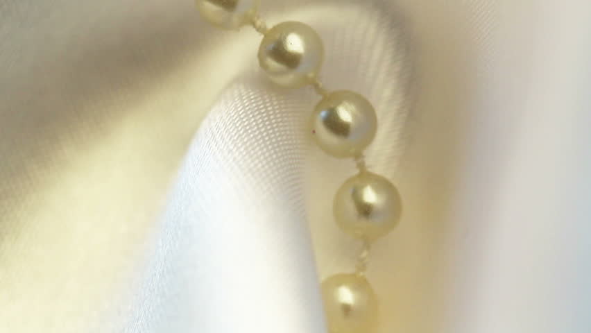 wedding background. beads on silk spinning closeup