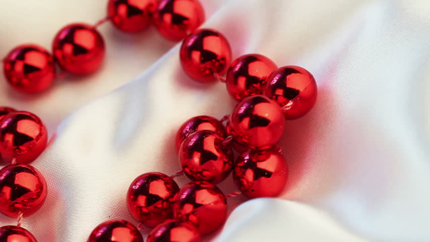 wedding background. beads on silk spinning closeup