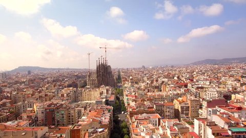 Sagrada Familia cathedral and Barcelona city aerial view in Spain, 4K drone footage.