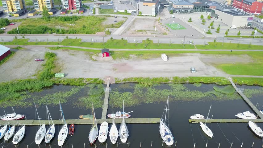 4K aerial video footage view of medieval Porvoo old town on river Porvoonjoki, cathedral, river embankment, boats, old warehouses and area 50 km east of Helsinki, capital of Finland in northern Europe
