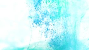 Turquoise and Blue ink spreading downward in water. Use for backgrounds or overlays requiring a flowing and organic look. Amazing video asset for motion graphics projects or VFX composites.