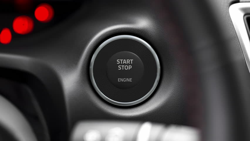 Pressing the button to start the car engine. Then camera zooming to a moving v8 engine in flames. Royalty-Free Stock Footage #30172366