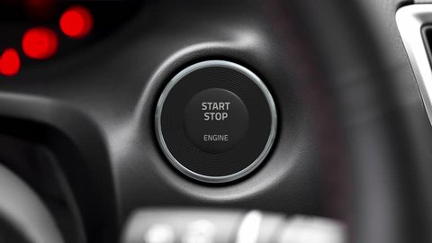 Pressing the button to start the car engine. Then camera zooming to a moving v8 engine in flames.