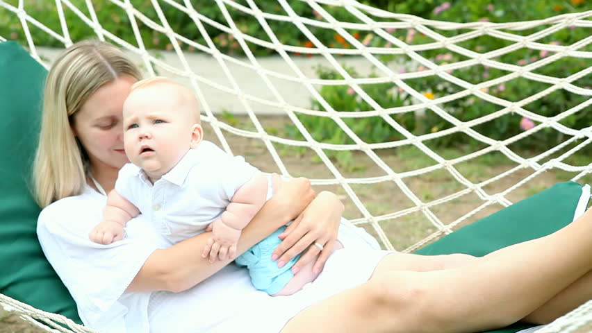 Happiness baby with mother in hammock   