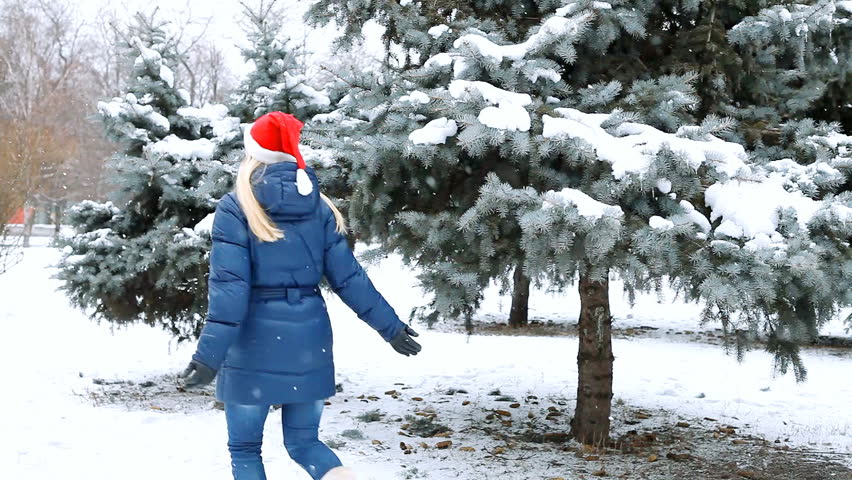 Happy girl  walks in winter wood 