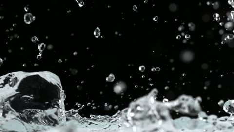 Water splash and ice cube shooting with high speed camera.