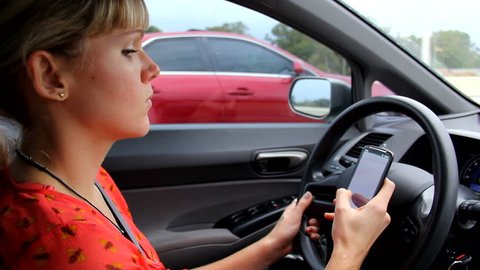 Woman texting while Driving