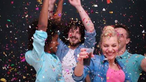 mixed race people celbration and party with confetti shower