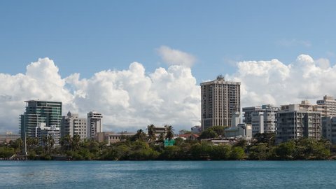 4K Timelapse pan shot right of San Juan Skyline Puerto Rico with clouds on a sunny day
