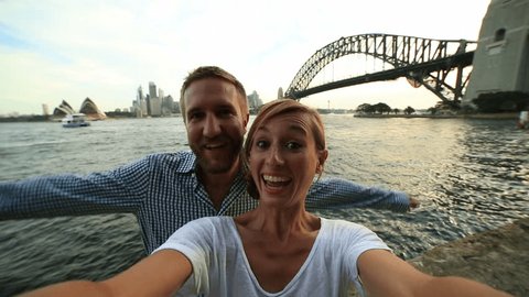 Self portrait of young couple with sydney skyline
Young couple in Sydney harbour take a selfie portrait with the Sydney skyline on the background.
