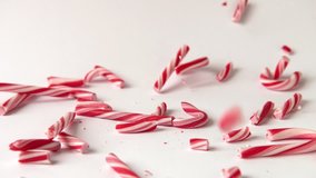 Broken Candy Canes in Slow motion / Falling Candy Canes broken on white Background - Powered by Shutterstock - Get 15% off with code: PIKWIZARD15