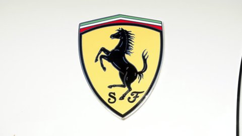Scottsdale, Arizona, USA - May 7, 2017: Ferrari logo on white Ferrari. Ferrari N.V. is an Italian sports car manufacturer based in Maranello. Founded by Enzo Ferrari in 1939.