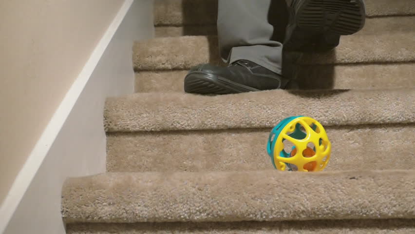 Man tripping and falling down stairs closeup 