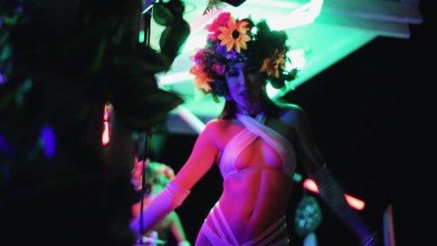 Beautiful girl is dancing. Disco. Night club. Ibiza. Openair. Holidays. A party. Night dance.