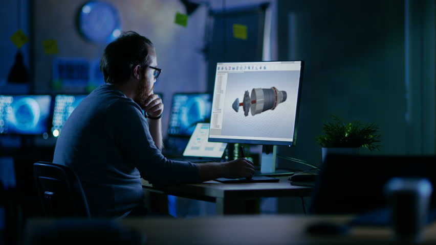 Young Bearded Engineer Works on a 3D Model Of Industrial Turbine. It's Late at Night He's the Only One Left on the Dark Office. Shot on RED EPIC-W 8K Helium Cinema Camera. Royalty-Free Stock Footage #30235195