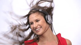 Video of a woman wearing a headphone while dancing