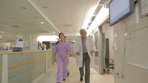 Doctor Male Female Nurse Scrubs Rushing Stock Footage Video (100% ...