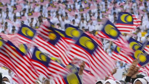 Malaysia, Circa 2017 - Malaysian waves Malaysia Flag during the Independence Day or Merdeka. Malaysia celebrates her 60th Independence Day or Hari Merdeka at the Merdeka Square, Kuala Lumpur. Upscaled