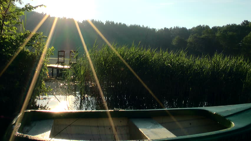 Lake at sunrise, boat,  Masuria lake district – Stock video