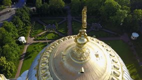 4K aerial video footage view of beautiful Nikolskiy Navy cathedral, anchor square, area around it in the heart of Kronstadt town near St Petersburg 700 km from Moscow, Russia on clear summer morning