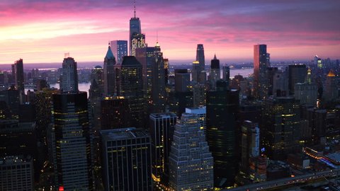 Lower Manhattan skyline, Famous skyscrapers during sunset in the Financial District of New York City. United States, North America. Shot from helicopter.
