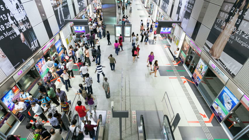 SINGAPORE - 13 NOVEMBER 2012: Timelapse of commuters taking the Singapore Subway