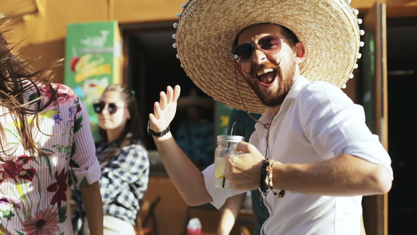 Street carnival fiesta concept - mexican and turkish student it developer programmers guy dancing hard rave at the old city town | Shutterstock HD Video #30263713
