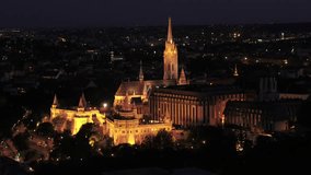 Aerial video shows the Matthias Church and the Castle Hill in Budapest night