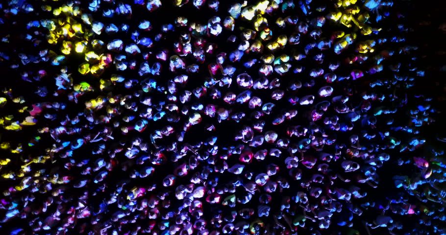 A crowd of people at a concert.
drone point of view