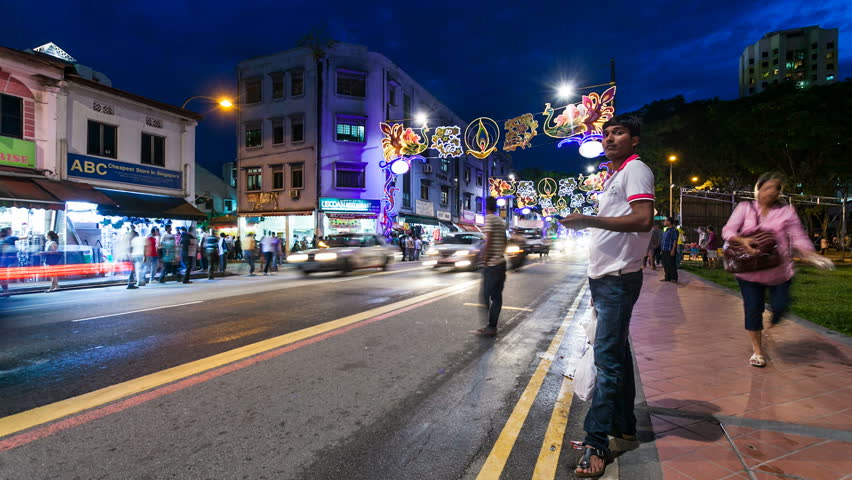 SINGAPORE - 13 NOVEMBER 2012: Night Timelapse of street life in Little India in