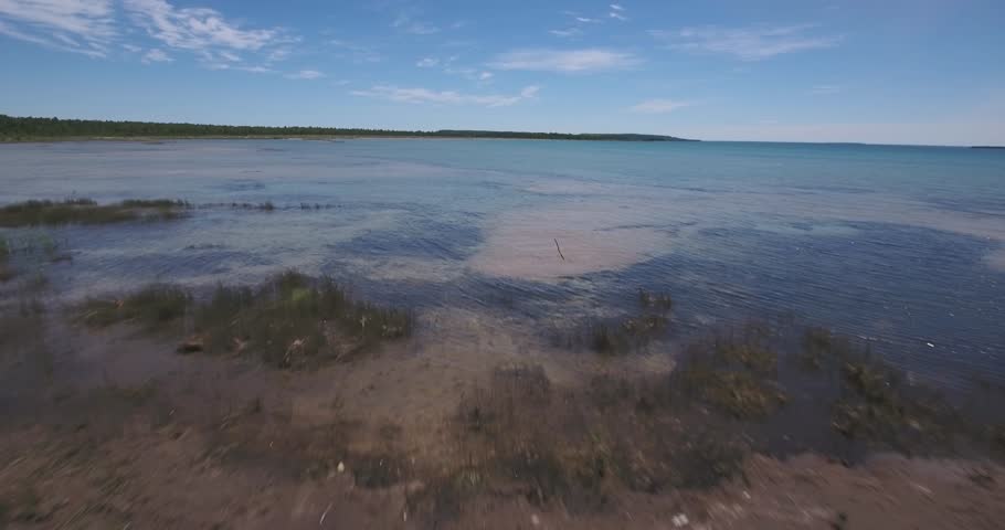Flying above crystal clear waters on Lake Michigan.