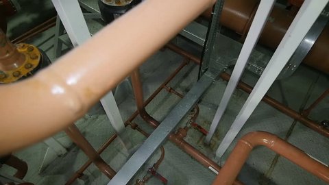 KAZAN, TATARSTAN/RUSSIA - DECEMBER 20 2016: Camera removes from long pipe constructions against modern equipment in powerful oil enterprise on December 20 in Kazan