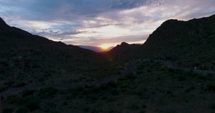Flying upwards as the sun breaks the morning horizon in Tucson. 