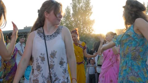 Kherson, Ukraine 30 July 2017: group of woman in Indian clothes have fun with Raised hands on open air in Kherson, 30 July 2017.