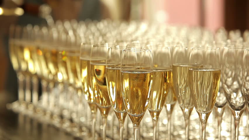 Many glasses of champagne on the table  | Shutterstock HD Video #3028294