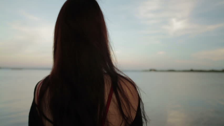 girl stands on shore bay looks Stock Footage Video (100% Royalty-free ...