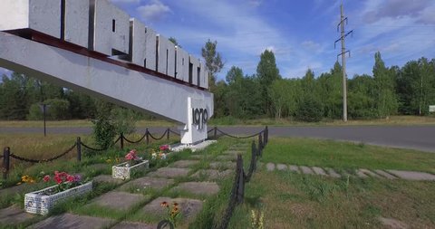 Chernobyl Exclusion Zone, Ukraine,  - July 12, 2015: Aerial video. Entrance sign to the now-abandoned Ukraine city of Pripyat, 4K.