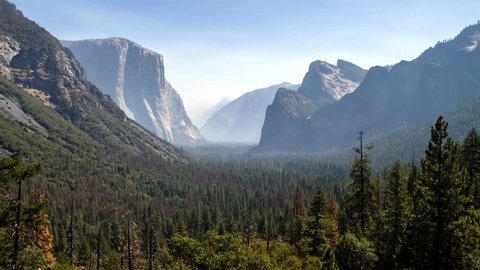 CALIFORNIA - USA, AUGUST 2017: Tunnel View of Yosemite Valley with fog and smoke