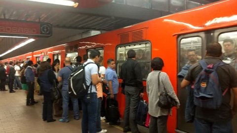 POLANCO, MEXICO CITY-July 31, 2017.  Auditorio Subway Station in the Polanco neighborhood. Pedestrians board an arriving subway train.