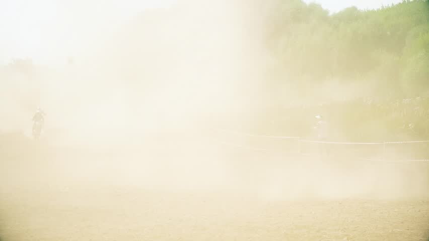 Racing on motorcycles, jumping on a dusty road hd
