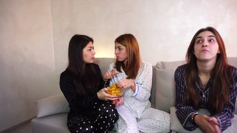 Two friends urge woman to eat bad food. girl is on strict diet. concept of healthy intuitive nutrition, fast food debris, gluten-free lactose-free vegan vegeterian diet