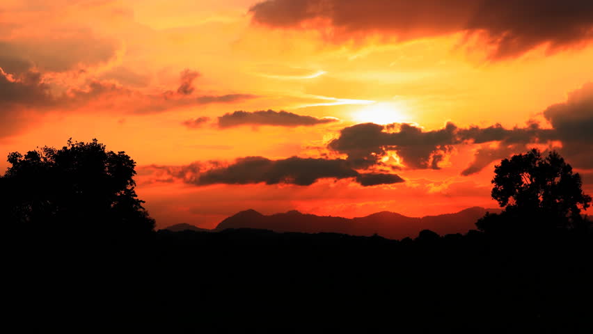 sunset in red sky cloud beautiful and silhouette forest.  Time Lapse VDO 4K