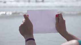 High quality video of paper in hands by the ocean in real 1080p slow motion 250fps
More videos from this series in my portfolio