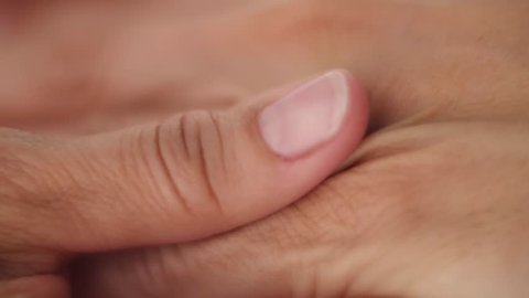 Massage of hands close up on a white background 