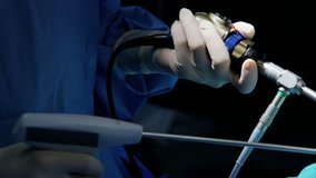 Laparoscopy surgical training operation surgeons using Endoscope and Laparoscope instruments wearing surgical gloves and scrubs RED DRAGON
